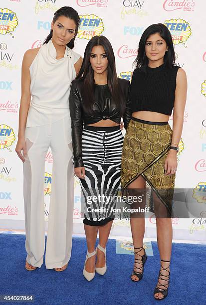 Kendall Jenner, Kim Kardashian and Kylie Jenner arrive at the 2014 Teen Choice Awards at The Shrine Auditorium on August 10, 2014 in Los Angeles,...