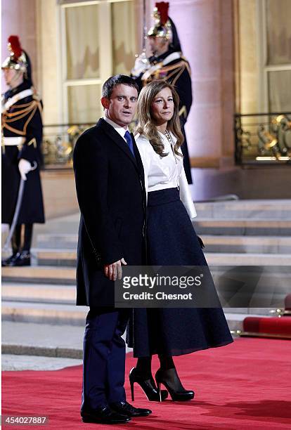 French Interior Minister Manuel Valls and his wife Anne Gravoin arrive for a diner at the Elysee presidential palace in Paris, as part of the Elysee...