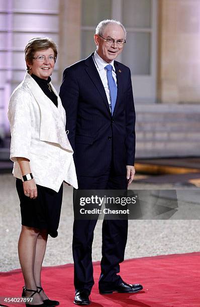 President of the European Council Herman Van Rompuy, right and his wife Geertrui Windels arrive for a diner at the Elysee presidential palace in...