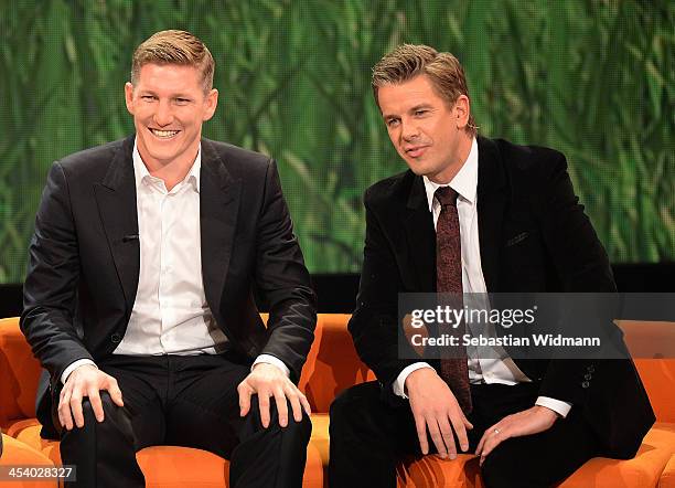 Bastian Schweinsteiger and Markus Lanz attend the taping of the 'Menschen 2013' Show on December 6, 2013 in Munich, Germany.