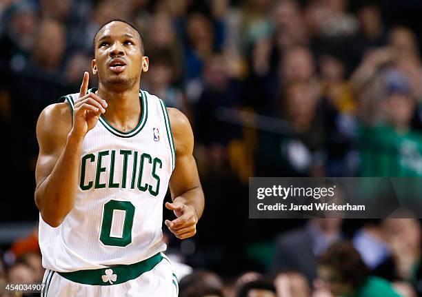 Avery Bradley of the Boston Celtics reacts following a three point shot in the second half against the Denver Nuggets during the game at TD Garden on...