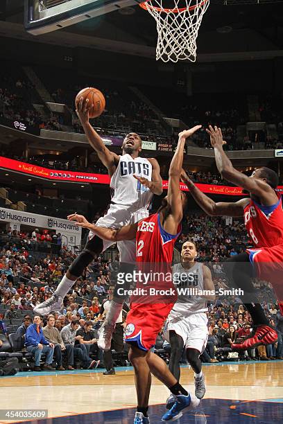 Kemba Walker of the Charlotte Bobcats shoots against the Philadelphia 76ers during the game at the Time Warner Cable Arena on December 6, 2013 in...