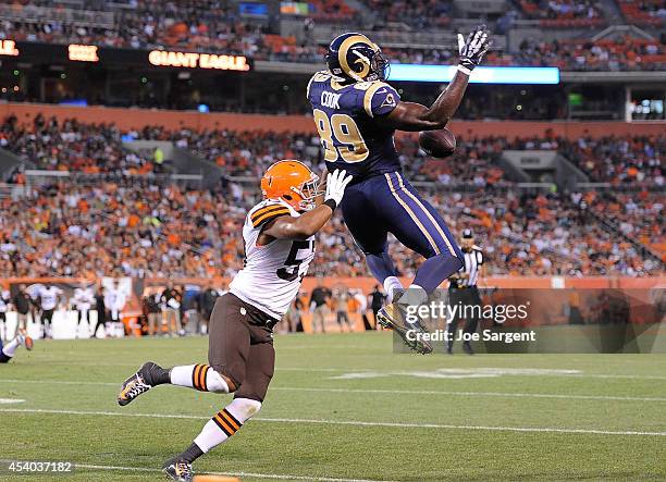 Jared Cook of the St. Louis Rams can't make a catch in front of Craig Robertson of the Cleveland Browns at FirstEnergy Stadium on August 23, 2014 in...