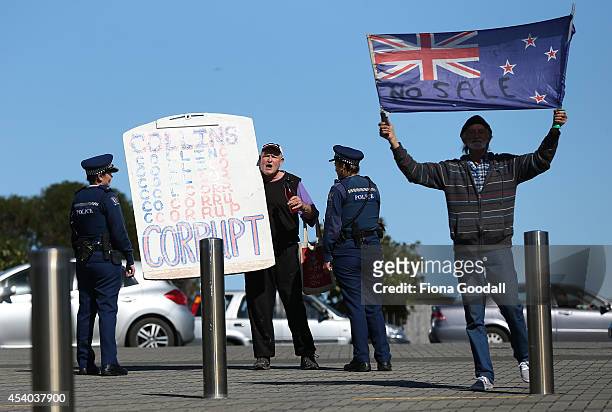 Protesters are moved to the footpath by police outside the Vodafone Events Centre as they wait for the arrival of Leader of the National Party, John...
