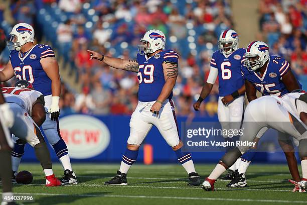 Kraig Urbik, Doug Legursky and Chris Hairston of the Buffalo Bills line up against the Tampa Bay Buccaneers during the second half at Ralph Wilson...