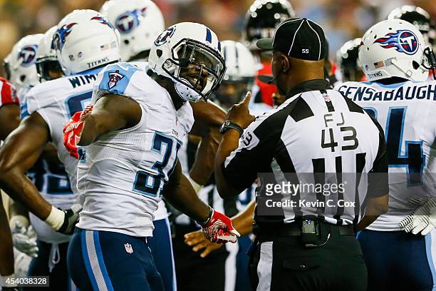 Bernard Pollard of the Tennessee Titans argues with an official in the first half of a preseason game against the Atlanta Falcons at the Georgia Dome...