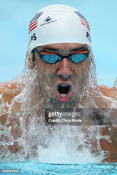 Michael Phelps of the USA swims the Men's 200m IM heats during day four of the 2014 Pan Pacific Championships at Gold Coast Aquatics on August 24,...