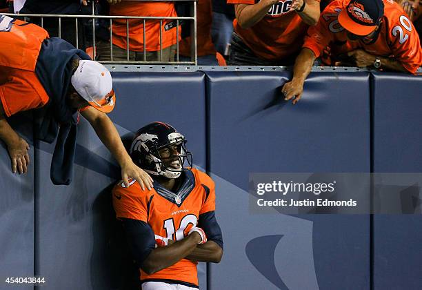 Wide receiver Emmanuel Sanders of the Denver Broncos celebrates with Denver Broncos fans after catching a pass for a 67-yard touchdown against the...
