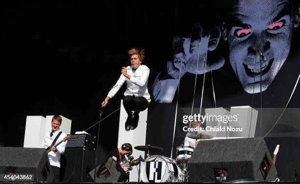 Dr Matt Destruction, Howlin' Pelle Almqvist and Chris Dangerous of The Hives perform on Day 2 of the Reading Festival at Richfield Avenue on August...