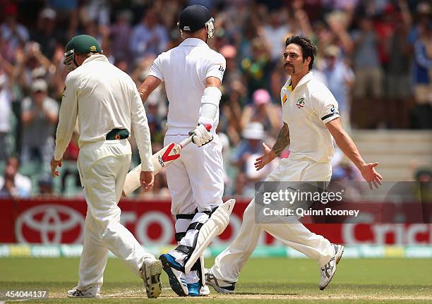 Mitchell Johnson of Australia celebrates after taking the wicket of James Anderson of England during day three of the Second Ashes Test match between...