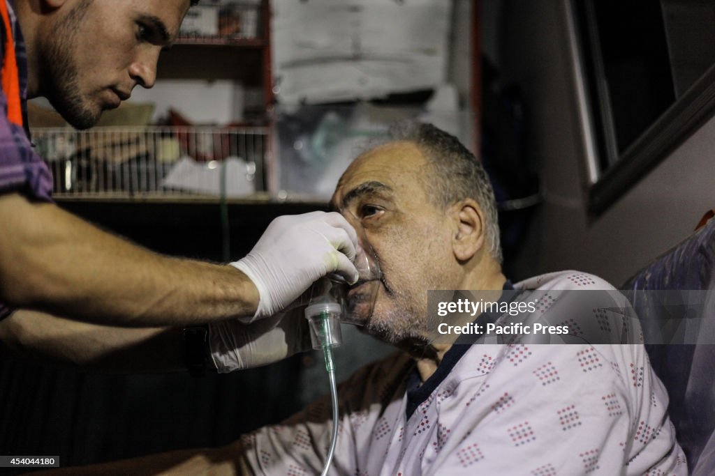 A Palestinian man is checked by medical staff after the air-...