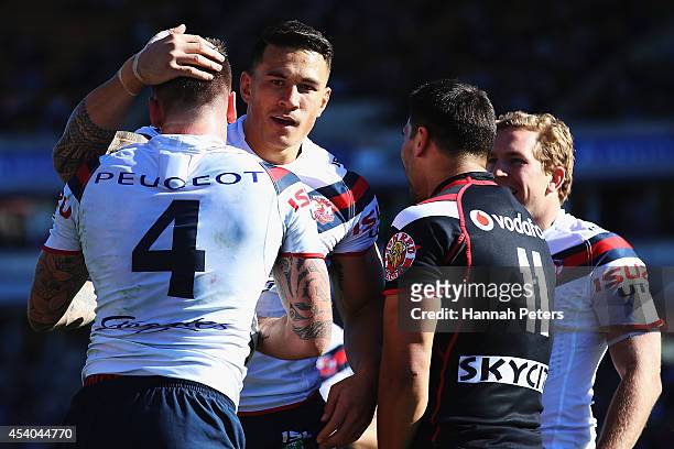 Shaun Kenny-Dowall of the Roosters celebrates with Sonny Bill Williams after scoring a try during the round 24 NRL match between the New Zealand...