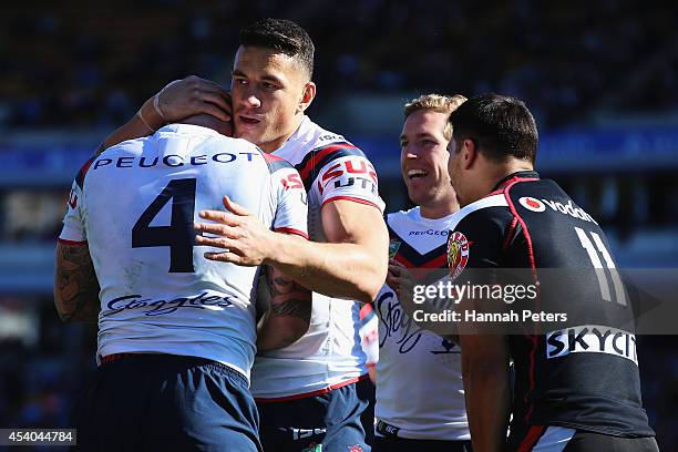 Shaun Kenny-Dowall of the Roosters celebrates with Sonny Bill Williams after scoring a try during the round 24 NRL match between the New Zealand...