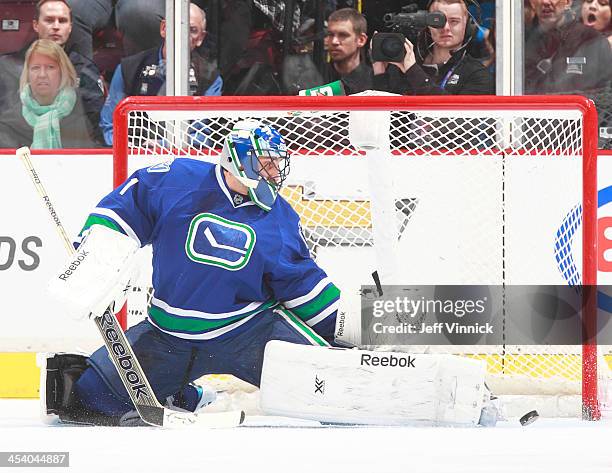 Roberto Luongo of the Vancouver Canucks makes a save against the Phoenix Coyotes during their NHL game at Rogers Arena on December 6, 2013 in...