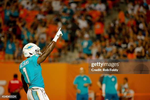 Damian Williams of the Miami Dolphins reacts after a play during the game against the Dallas Cowboys at Sun Life Stadium on August 23, 2014 in Miami...