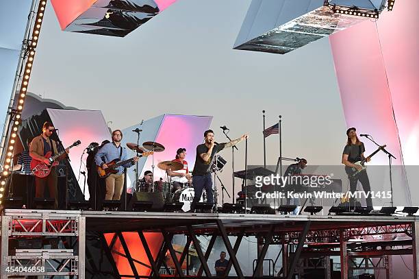 Musicians Jesse Carmichael, Mickey Madden, Matt Flynn, Adam Levine, PJ Morton and James Valentine of the band Maroon 5 perform onstage during...
