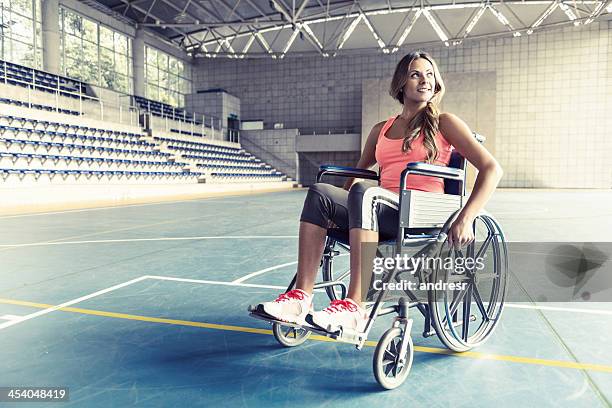 injured woman in a wheelchair - workout recovery stock pictures, royalty-free photos & images