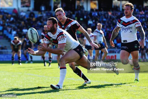 Boyd Cordner of the Roosters collects the ball to dive over and score a try during the round 24 NRL match between the New Zealand Warriors and the...