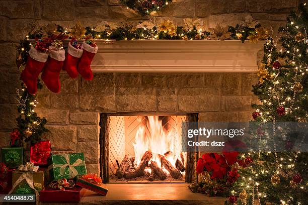 christmas fireplace, stockings, gifts, tree, copy space - row of christmas trees stock pictures, royalty-free photos & images