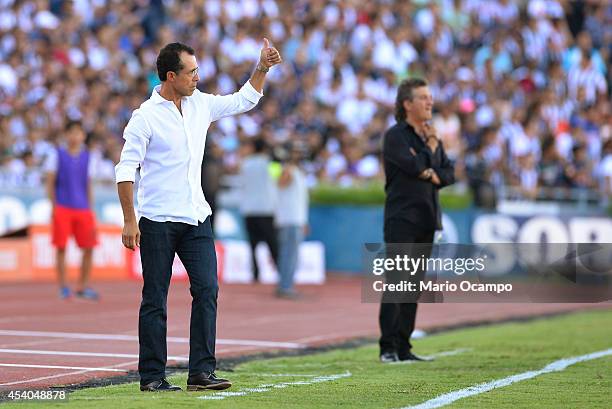 Carlos Barra, coach of Monterrey, gives a thumb up during a match between Monterrey and Puebla as part of 6th round Apertura 2014 Liga MX at...