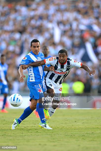 Dorlan Pabon of Monterrey fights for the ball with Luis Esqueda of Puebla during a match between Monterrey and Puebla as part of 6th round Apertura...