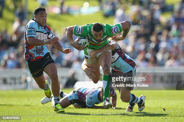 Paul Vaughan of the Raiders is tackled during the round 24 NRL match between the Cronulla Sharks and the Canberra Raiders at Remondis Stadium on...