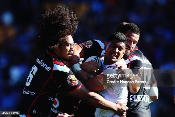 Sione Lousi of the Warriors tackels Daniel Tupou of the Roosters during the round 24 NRL match between the New Zealand Warriors and the Sydney...