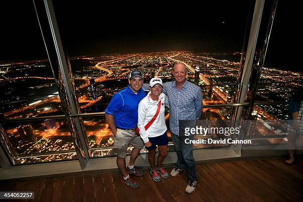 Stacy Lewis of the USA with her manager Jeff Chilcoat and her caddie Travis Wilson on the 154th floor of the Burj Khalifa the World's tallest...
