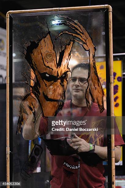 An artist paints a drawing during Wizard World Chicago Comic Con 2014 at Donald E. Stephens Convention Center on August 23, 2014 in Chicago, Illinois.