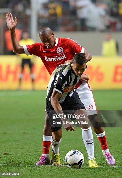 Alex Silva of Atletico MG and Wellington Silva of Internacional battle for the ball during a match between Atletico MG and Internacional as part of...