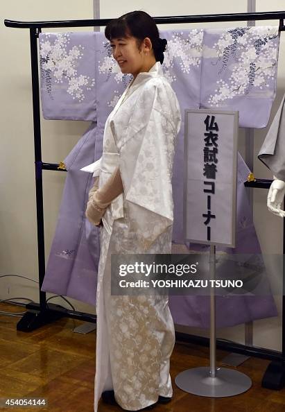 Japanese Death Robe A woman on a kimono dress designed for 'the last journey after death ...