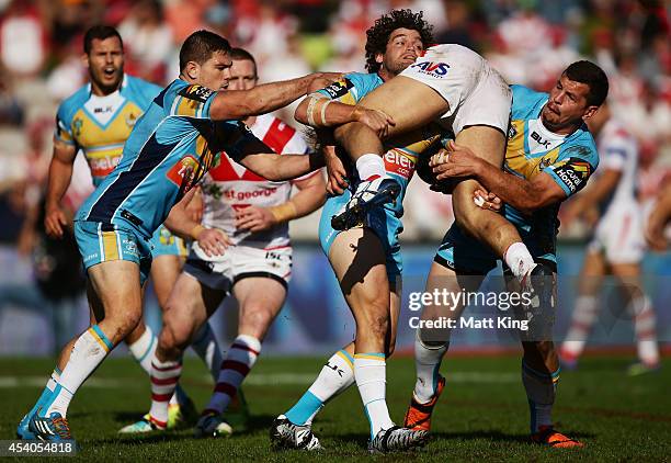 Jack de Belin of the Dragons is tackled during the round 24 NRL match between the St George Illawarra Dragons and the Gold Coast Titans at WIN...