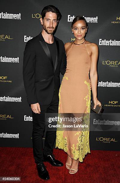 Actor Iddo Goldberg and actress Ashley Madekwe attend the 2014 Entertainment Weekly pre-Emmy party at Fig & Olive Melrose Place on August 23, 2014 in...