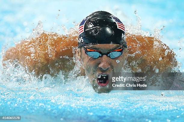 Michael Phelps of the USA swims the Men's 200m IM Final during day four of the 2014 Pan Pacific Championships at Gold Coast Aquatics on August 24,...