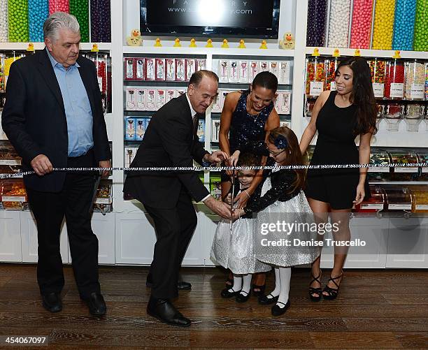 Steve Sisolak, Tom Racine, Charissa, Gracie, Brooklyn and Veronica Davidiovici during the Sugar Factory grand opening at Town Square on December 6,...