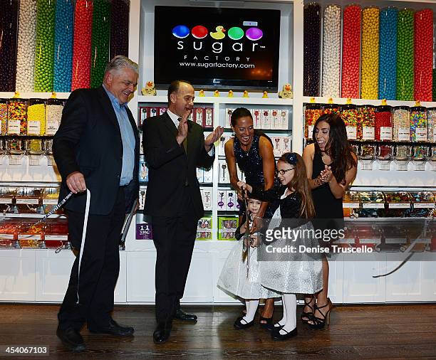 Steve Sisolak, Tom Racine, Charissa, Gracie, Brooklyn and Veronica Davidiovici during the Sugar Factory grand opening at Town Square on December 6,...