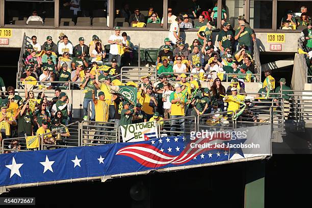Fans of the Oakland Athletics cheer during Game Five of the American League Division Series against the Detroit Tigers on Thursday, October 10, 2013...