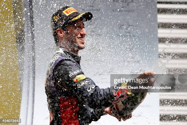 Daniel Ricciardo of Australia and Infiniti Red Bull Racing celebrates on the podium after winning the Belgian Grand Prix at Circuit de...