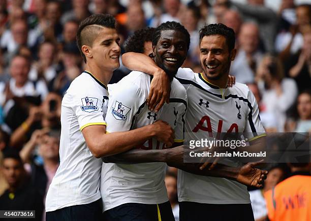 Emmanuel Adebayor of Spurs celebrates his goal with team mates during the Barclays Premier League match between Tottenham Hotspur and Queens Park...