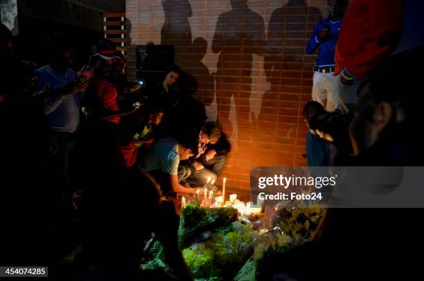 People are flocking to Nelson Mandela's former home in Vilakazi street on December 6, 2013 in Soweto, South Africa. Mourners have been gathering...