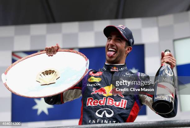 Daniel Ricciardo of Australia and Infiniti Red Bull Racing celebrates on the podium after winning the Belgian Grand Prix at Circuit de...