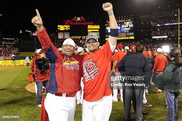 Brothers Bengie Molina and Yadier Molina of the St. Louis Cardinals celebrate after the Cardinals defeated the Los Angeles Dodgers 9-0 to win the...