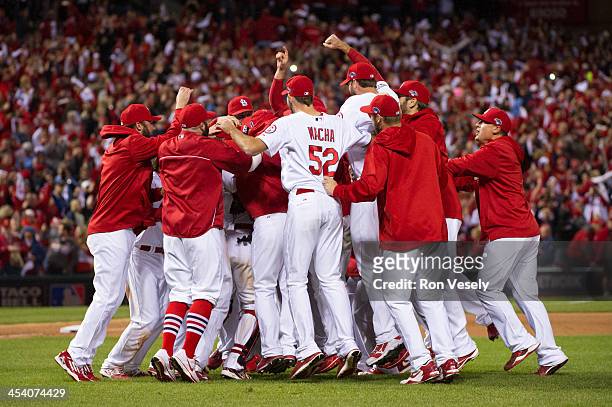 The St. Louis Cardinals celebrate a win during Game Six of the National League Championship Series against the Los Angeles Dodgers on Friday, October...