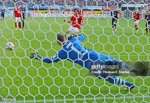 Ja - Cheol Koo of Mainz scores a penalty against goalkeeper Lukas Kruse of Paderborn during the Bundesliga match between SC Paderborn and FSV Mainz...