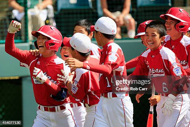 Takuma Takahashi of Team Japan celebrates after hitting a solo home run against the West Team from Las Vegas, Nevada during fourth inning of the...
