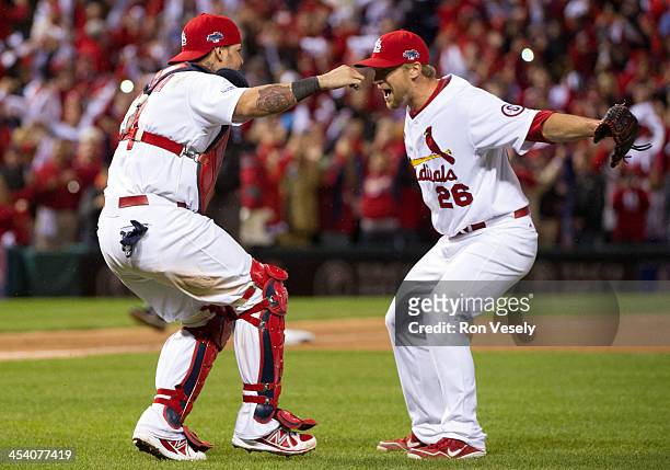 Trevor Rosenthal and Yadier Molina of the St. Louis Cardinals celebrate following a win during Game Six of the National League Championship Series...