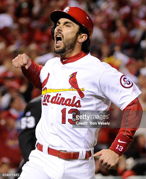 Matt Carpenter of the St. Louis Cardinals celebrates after scoring at home plate during Game Six of the National League Championship Series against...
