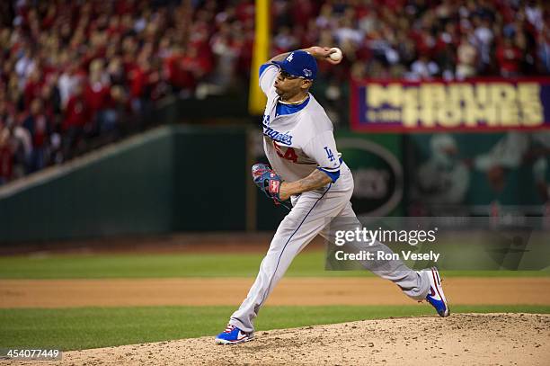 Ronald Belisario of the Los Angeles Dodgers pitches during Game Six of the National League Championship Series against the St. Louis Cardinals on...