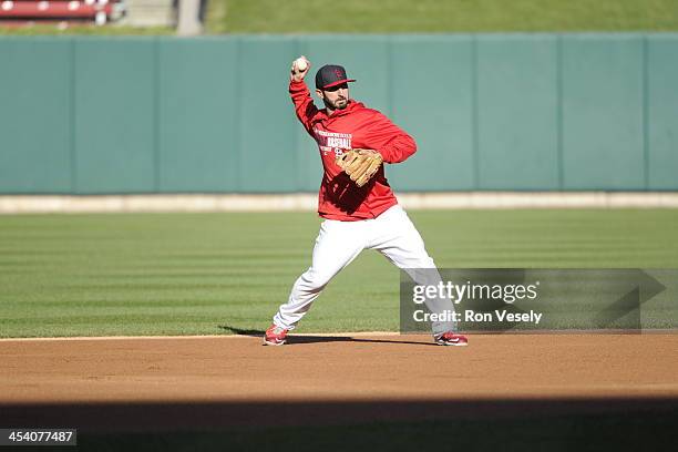 Daniel Descalso of the St. Louis Cardinals fields ground balls during batting practice prior to Game Six of the National League Championship Series...