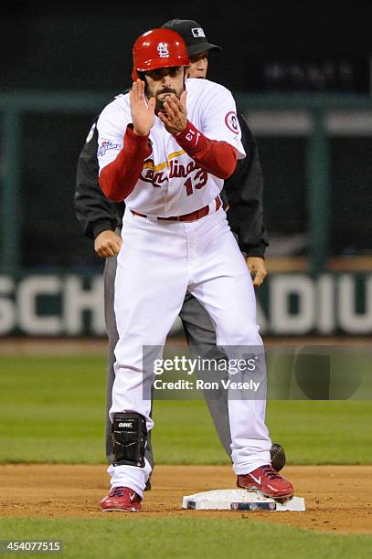 Matt Carpenter of the St. Louis Cardinals claps after advancing to second base during Game Six of the National League Championship Series against the...